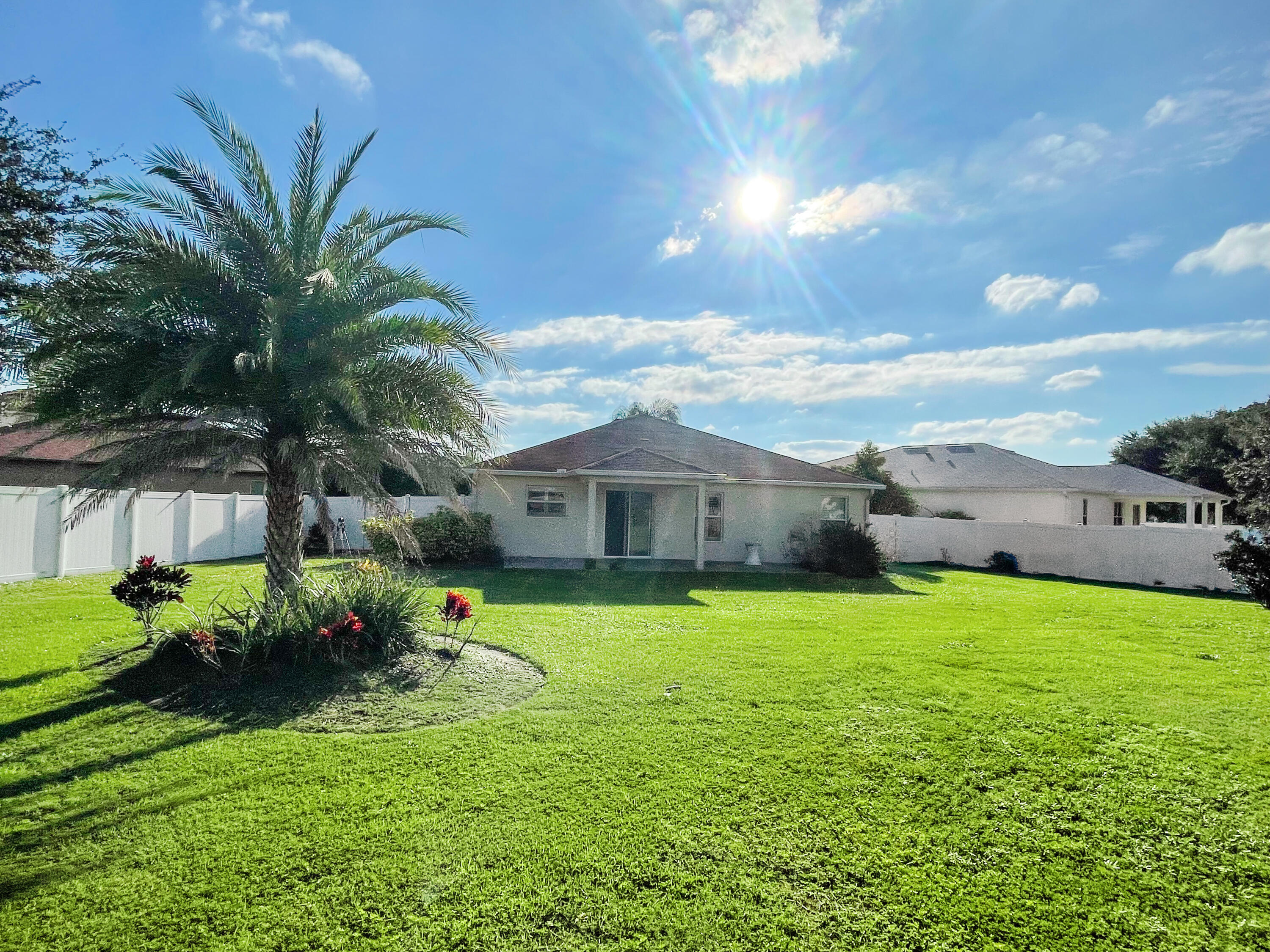 1641 Strathmore Circle Mount Dora, FL 32757 - Photo 19 of 21 a front view of a house with garden