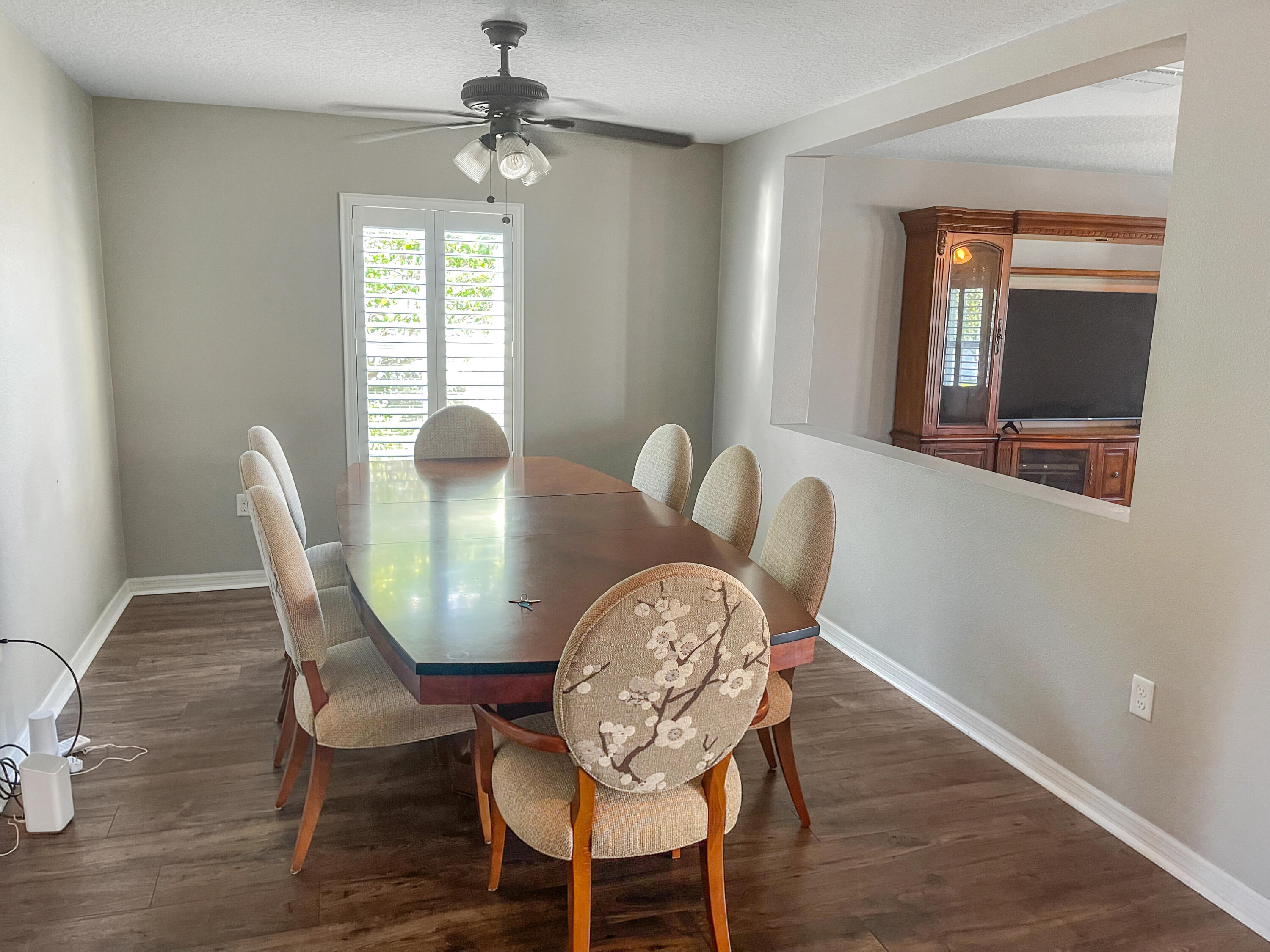 1641 Strathmore Circle Mount Dora, FL 32757 - Photo 3 of 21 a view of a dining room with furniture window and wooden floor