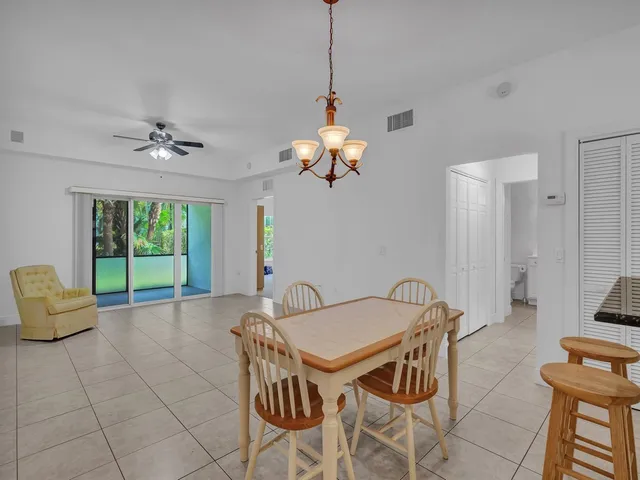 a view of a livingroom with furniture and a floor to ceiling window
