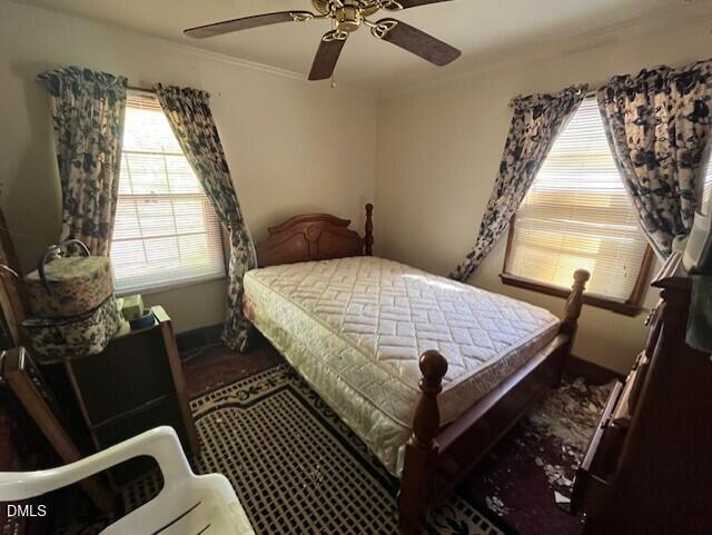 409 Edward Street Durham, NC 27701 - Photo 13 of 39 a bed sitting in a bedroom next to a window