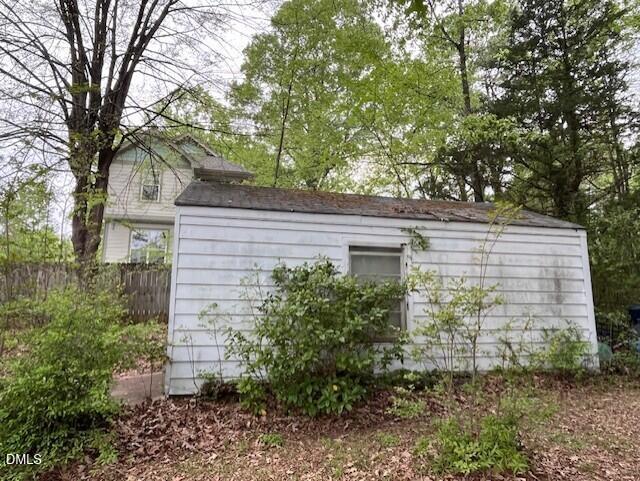 409 Edward Street Durham, NC 27701 - Photo 29 of 35 The side of the Shed with Neighbor Backy
