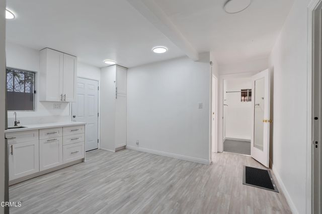 a bathroom with a sink a toilet and a shower