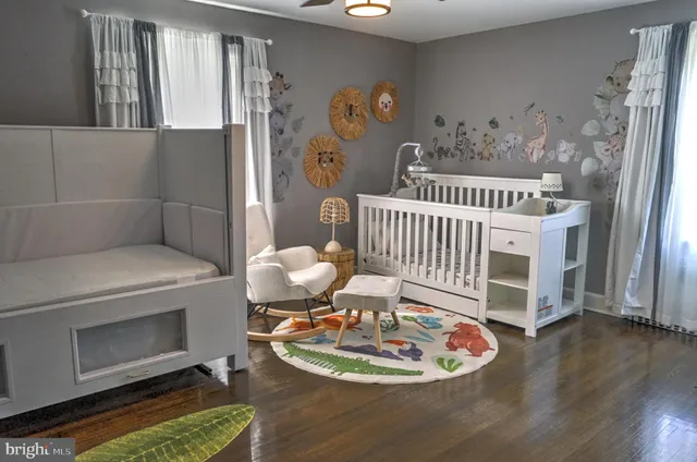 a dining room with furniture and wooden floor
