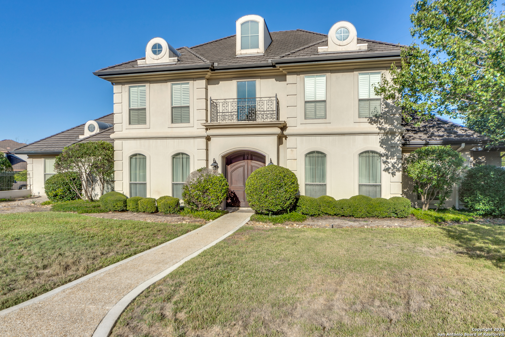 725 Contadora San Antonio, TX 78258 - Photo 1 of 1 a front view of a house with a yard