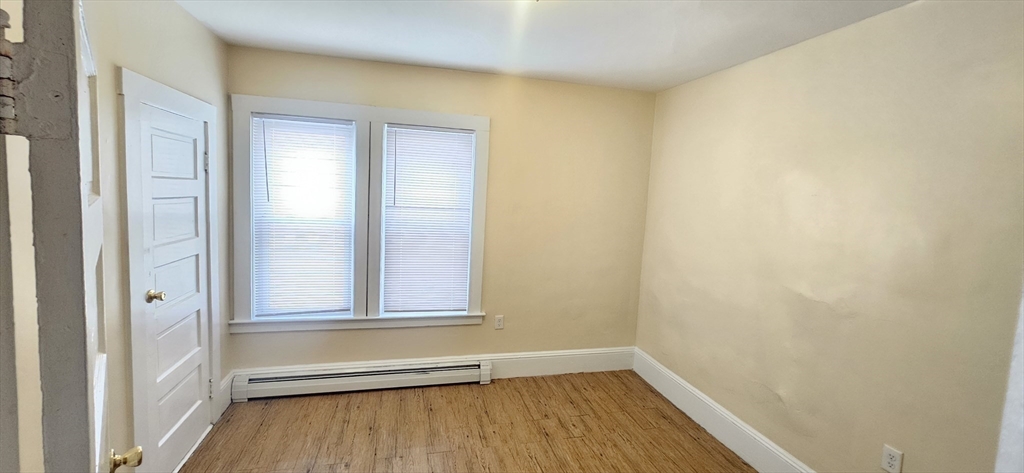 93 Arthur Street, Unit 3E Brockton, MA 02302 - Photo 4 of 8 a view of small space with wooden floor and closet