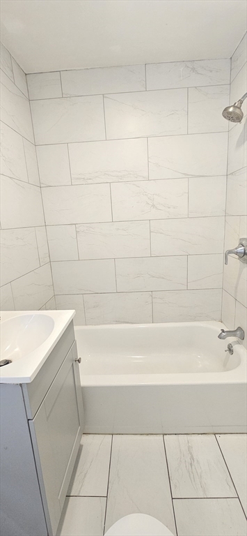 93 Arthur Street, Unit 3E Brockton, MA 02302 - Photo 8 of 8 a bathroom with a bathtub