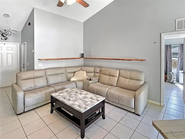 a living room with furniture and a couch