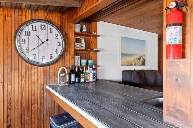 a view of a hallway with a dinning table and chairs