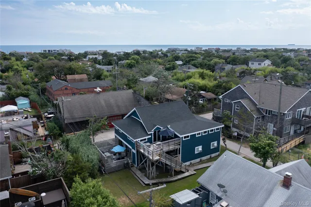 an aerial view of houses with yard