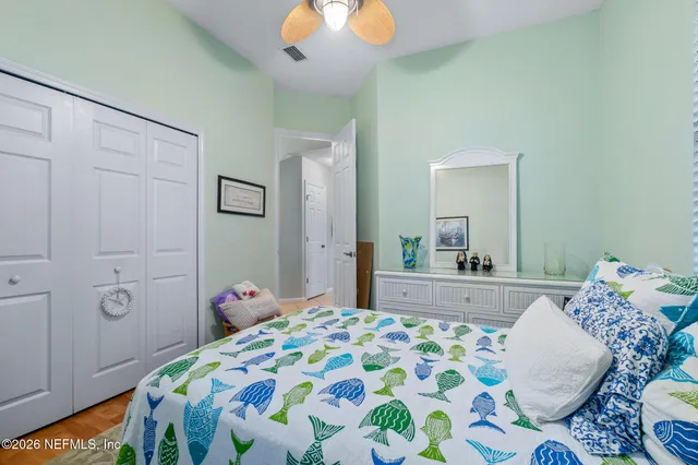 an aerial view of residential houses with outdoor space and swimming pool