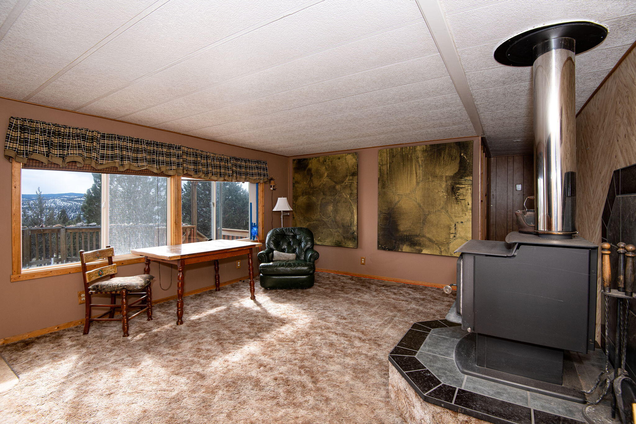 12312 Southeast Jack Rabbit Trail Prineville, OR 97754 - Photo 20 of 49 Living room with wood stove.