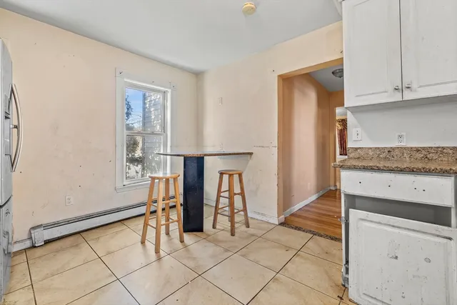 a view of kitchen with furniture and cabinets
