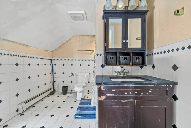 a bathroom with a sink a mirror and a shower