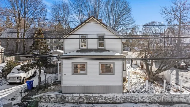 a front view of a house with garage