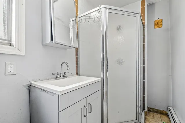 a bathroom with a sink and mirror