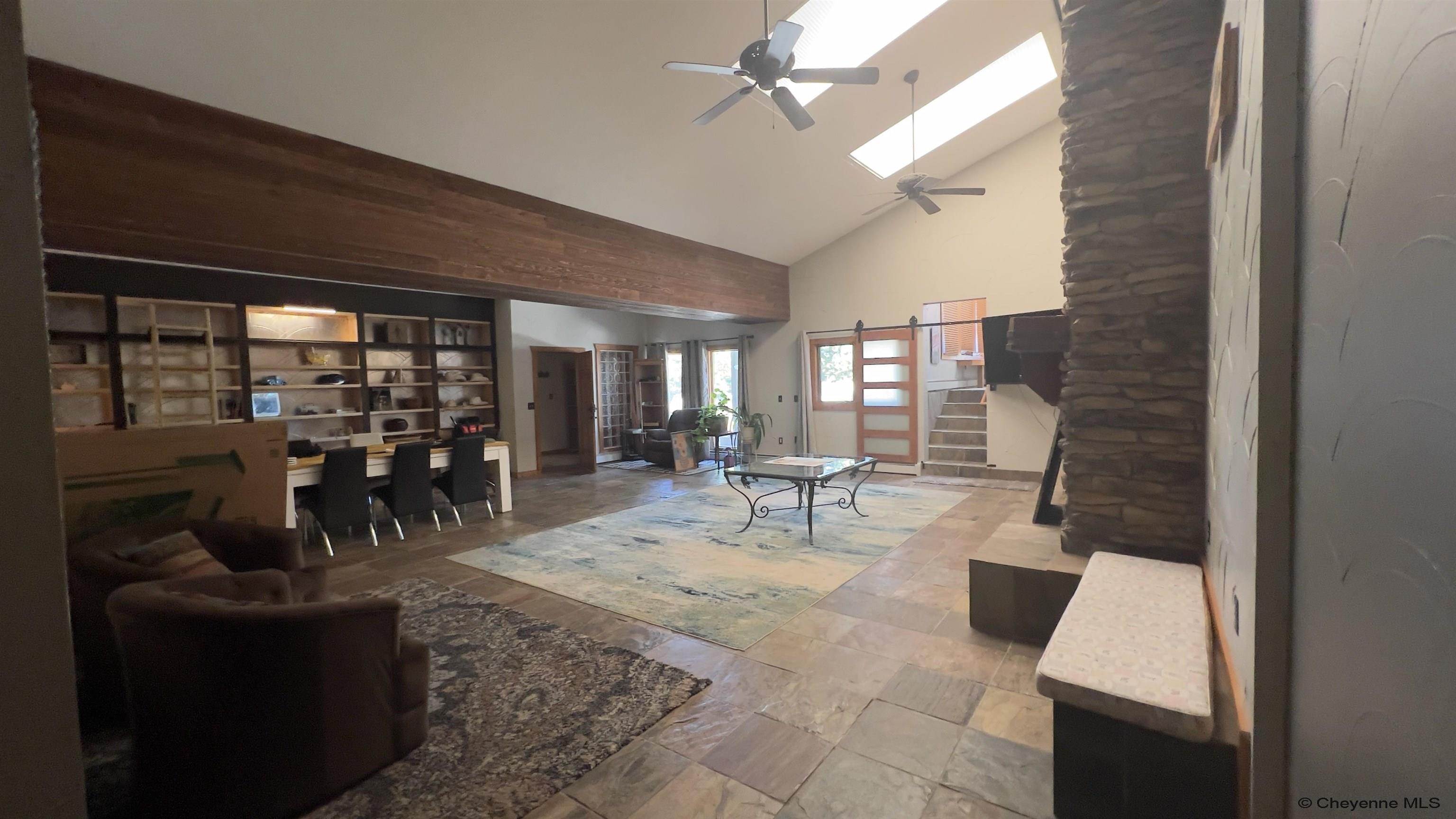 393 Happy Jack Road Cheyenne, WY 82009 - Photo 12 of 34 Entertaining guests get no better then walking into the main house and this being your first impression. Huge space to gather and build memories. Whatever you want to do this room has the space to do it.
