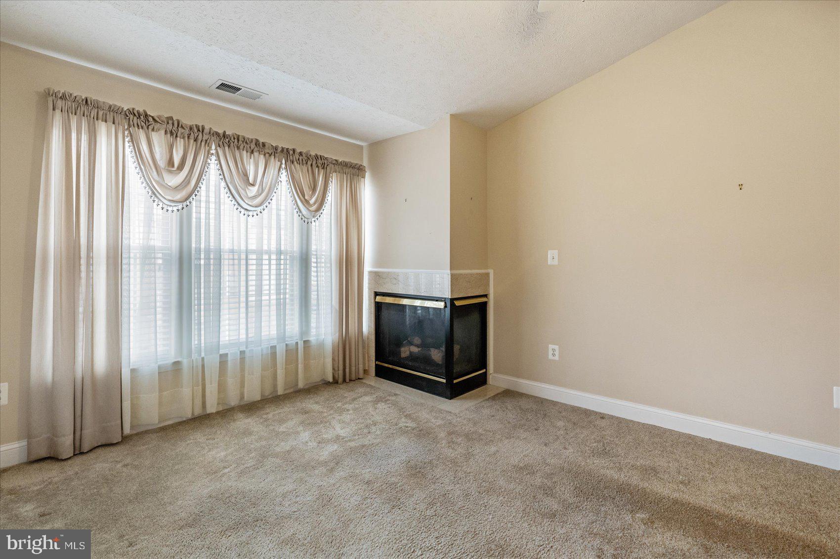 9609 Haven Farm Road, Unit M Perry Hall, MD 21128 - Photo 21 of 42 Corner fireplace perfectly nestled adding warmth!