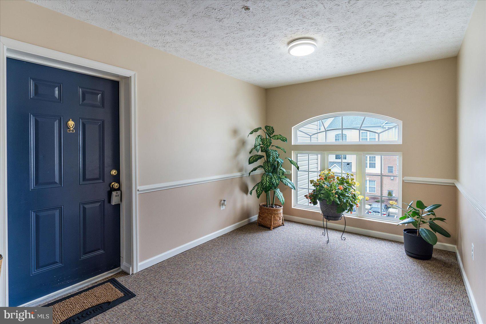 9609 Haven Farm Road, Unit M Perry Hall, MD 21128 - Photo 4 of 42 Bright, spacious lobby of entrance to unit!