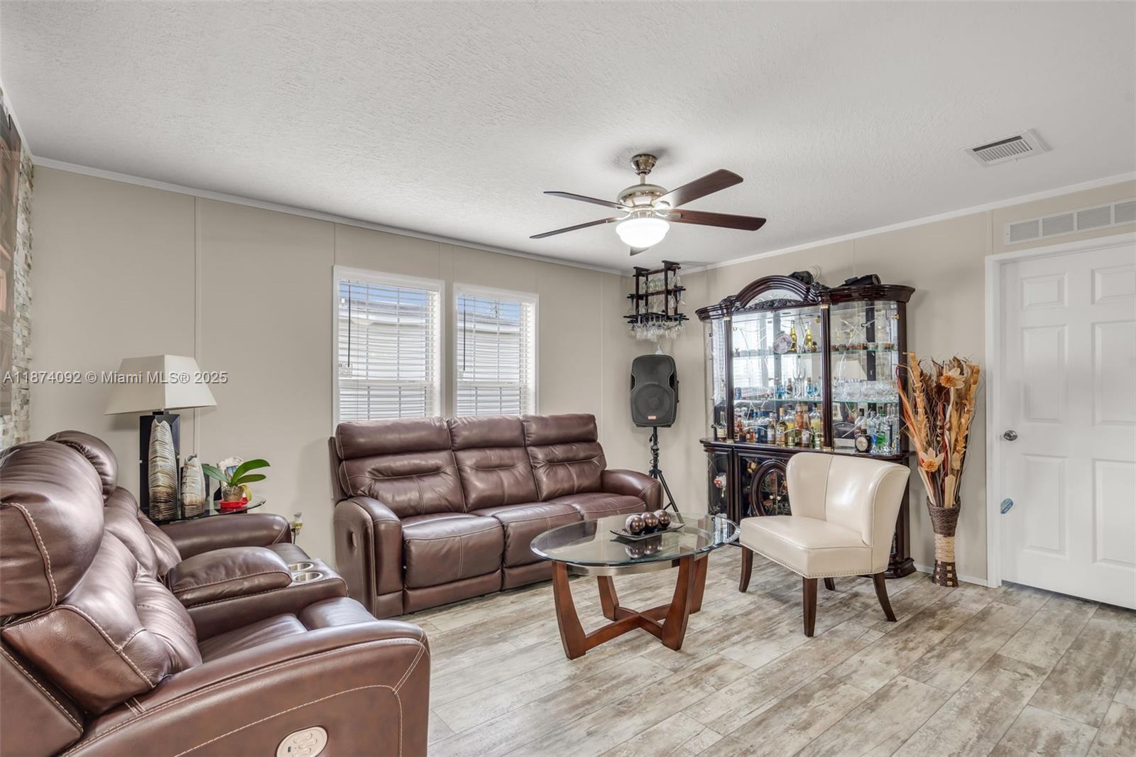 12850 West State Road, Unit 1 Davie, FL 33325 - Photo 15 of 32 a living room with furniture a chandelier and a window