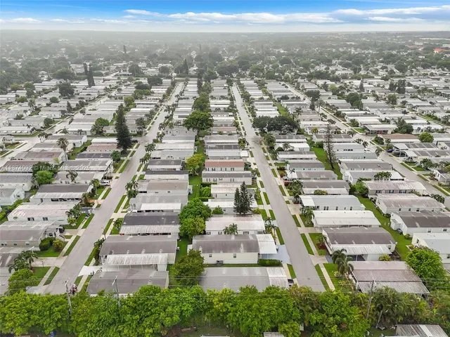an aerial view of residential building with parking space