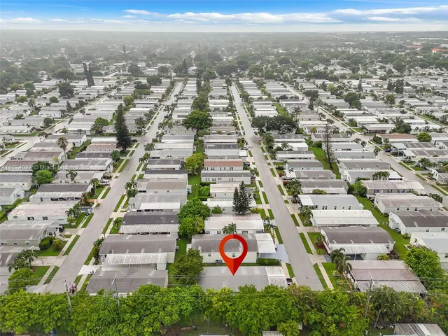 an aerial view of residential building and parking space