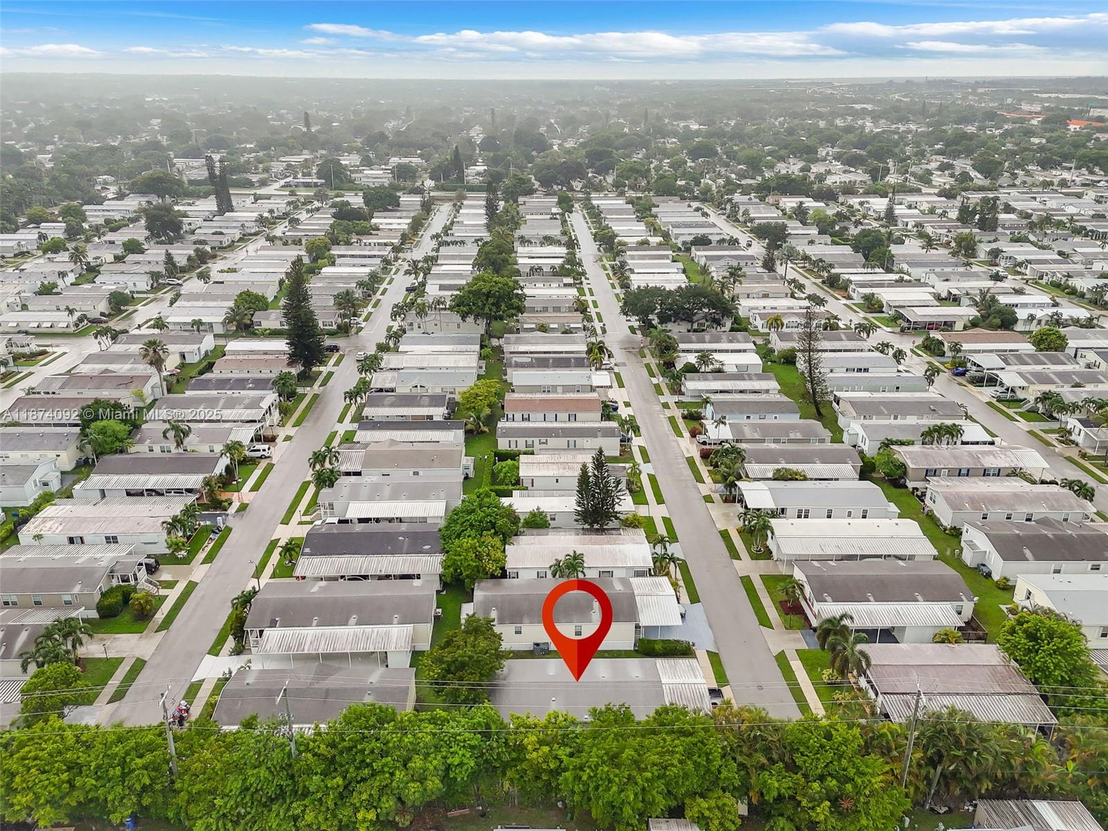 12850 West State Road, Unit 1 Davie, FL 33325 - Photo 25 of 32 an aerial view of residential building and parking space
