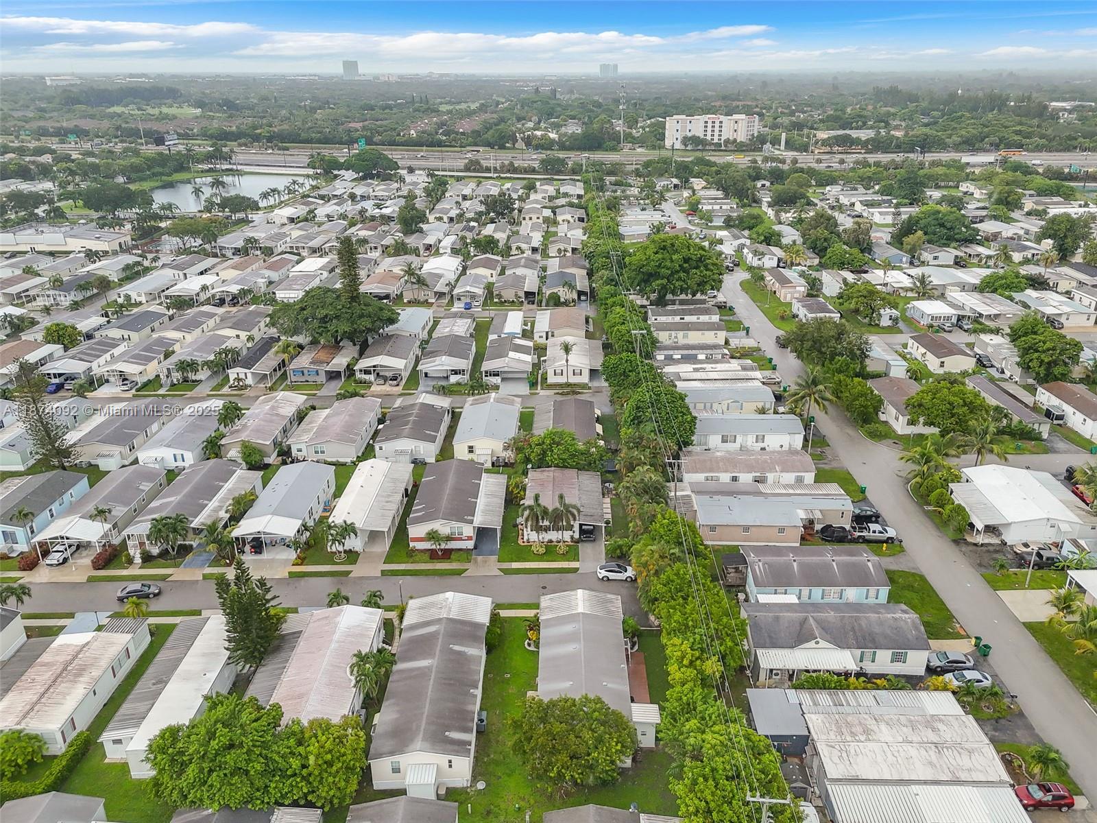 12850 West State Road, Unit 1 Davie, FL 33325 - Photo 27 of 32 an aerial view of residential houses with outdoor space