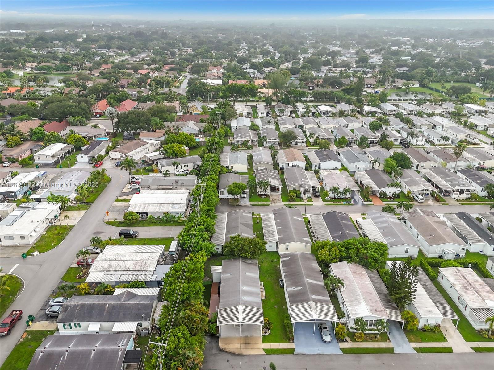 12850 West State Road, Unit 1 Davie, FL 33325 - Photo 31 of 32 an aerial view of residential houses with yard