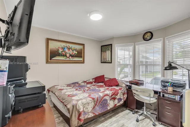 a bedroom with a bed and furniture