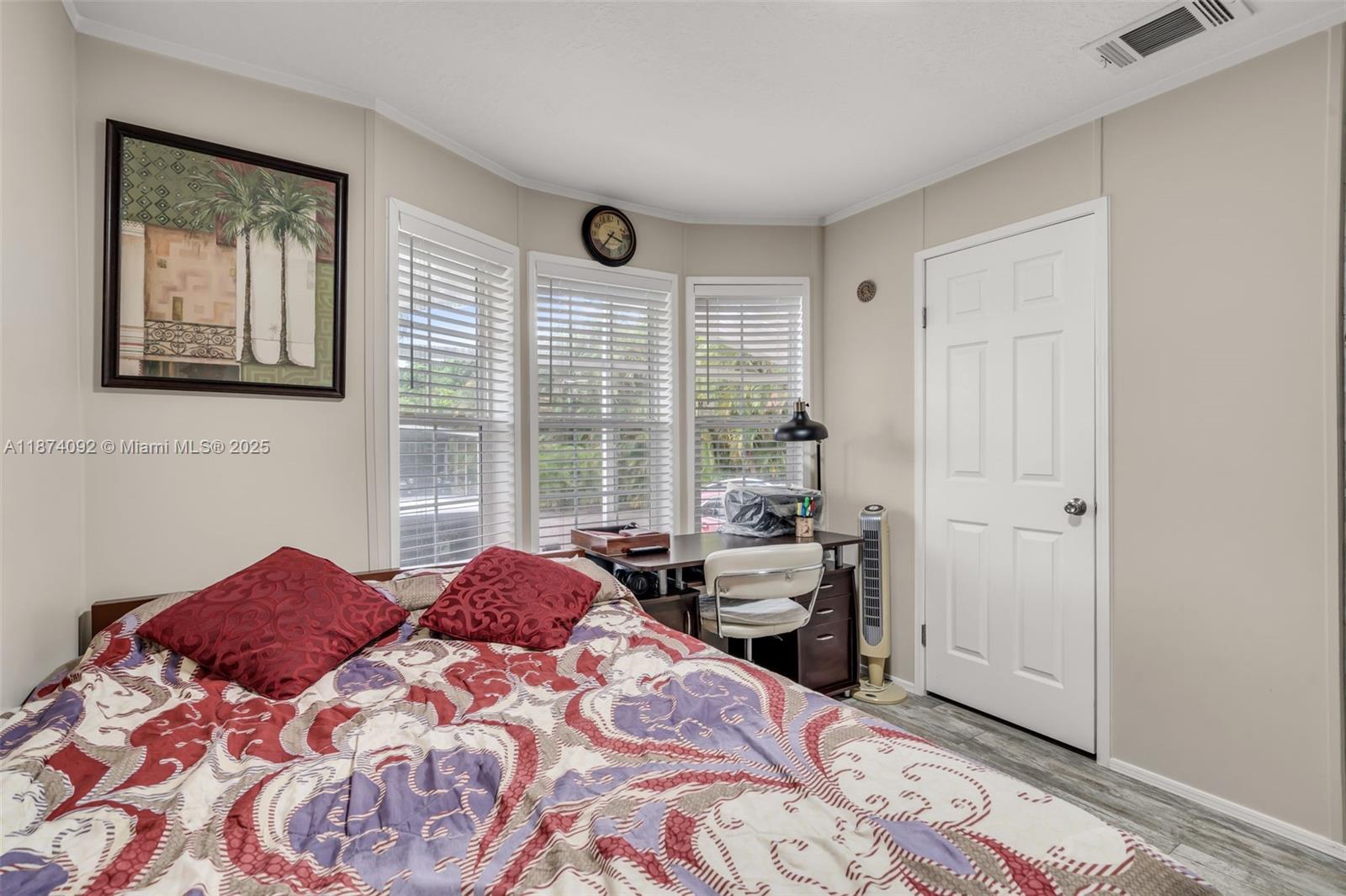 12850 West State Road, Unit 1 Davie, FL 33325 - Photo 10 of 32 a bed room with a bed and a window