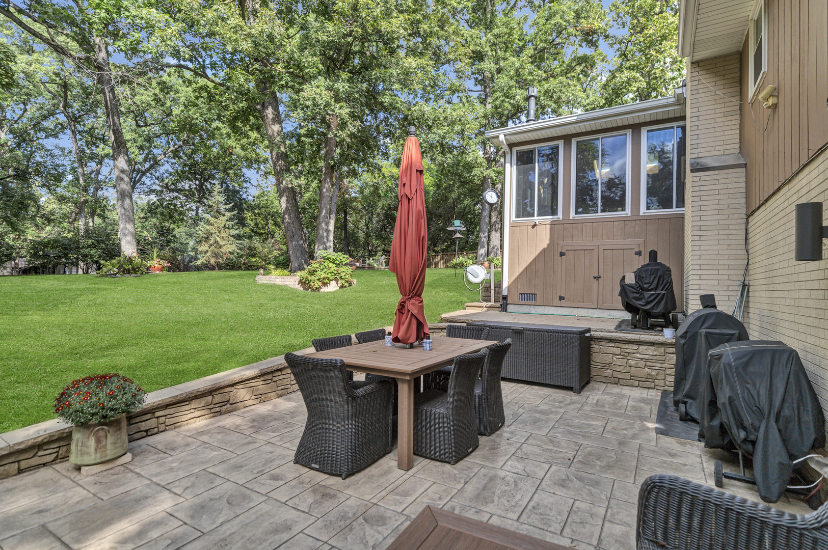 512 Forest Drive Addison, IL 60101 - Photo 11 of 61 a backyard of a house with barbeque oven table and chairs