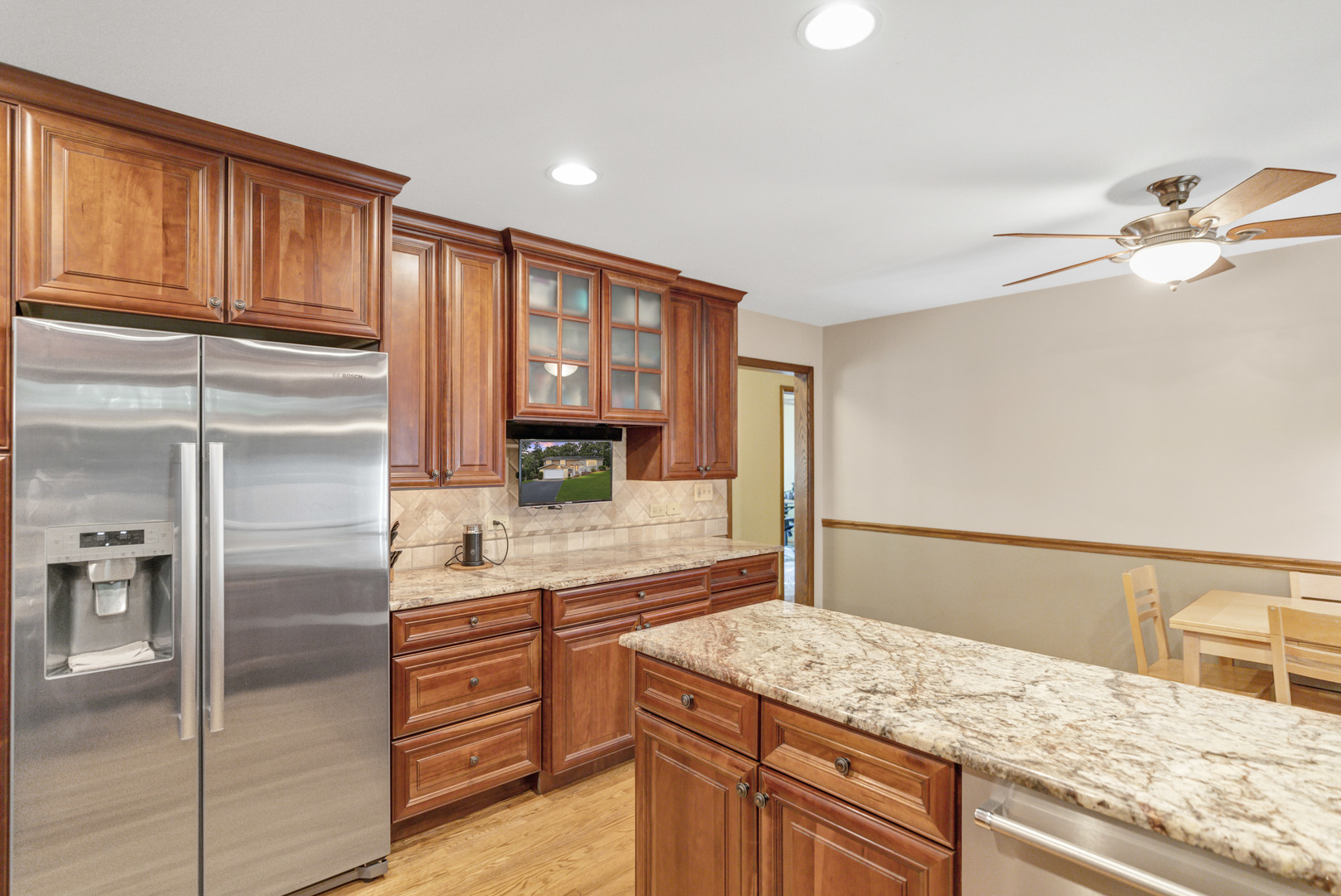 512 Forest Drive Addison, IL 60101 - Photo 31 of 61 a kitchen with stainless steel appliances granite countertop a refrigerator and a sink