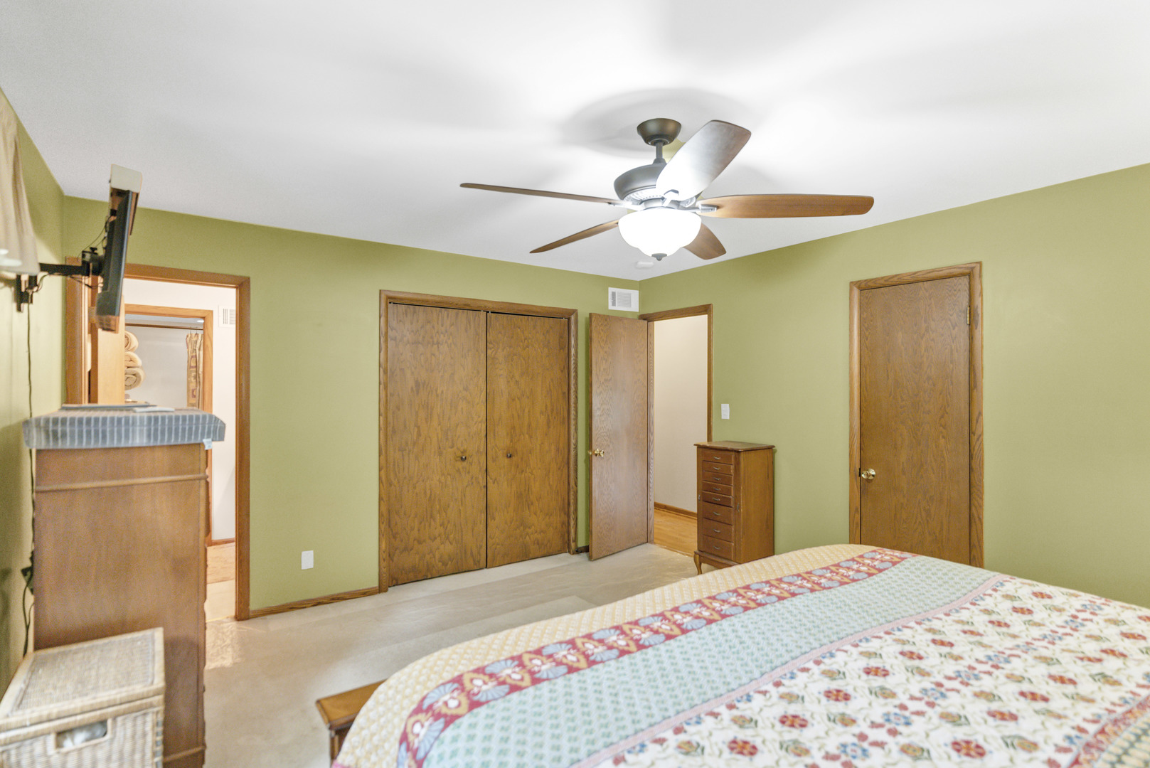 512 Forest Drive Addison, IL 60101 - Photo 36 of 61 a bedroom with a bed and a chandelier