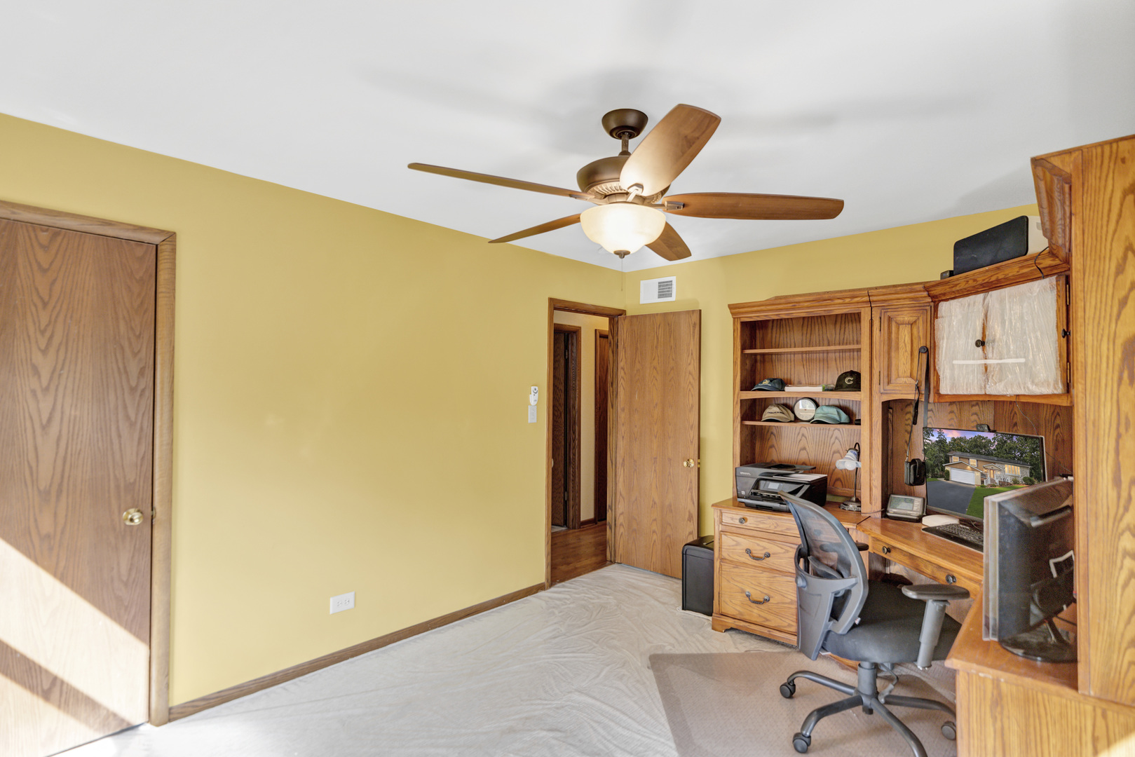 512 Forest Drive Addison, IL 60101 - Photo 41 of 61 a view of a workspace with furniture and a window