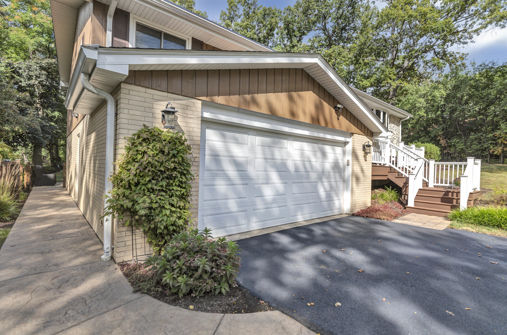 512 Forest Drive Addison, IL 60101 - Photo 5 of 61 a front view of a house with garden