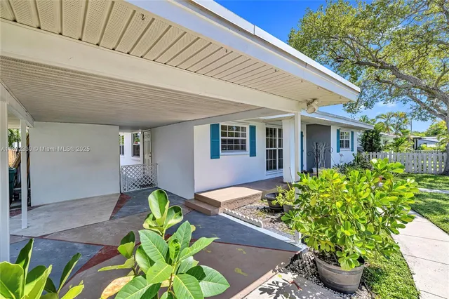 a front view of a house with outdoor seating