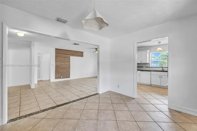 a view of a kitchen with a sink and a stove top oven