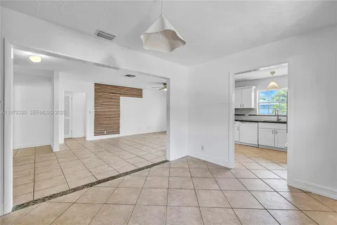 a view of a kitchen with a sink and a stove top oven
