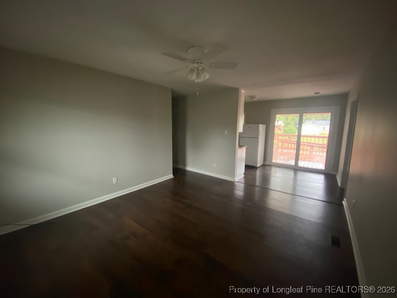 2711 Heatter Avenue Spring Lake, NC 28390 - Photo 2 of 14 wooden floor in an empty room with a window