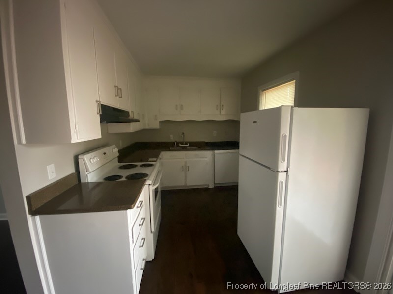 2711 Heatter Avenue Spring Lake, NC 28390 - Photo 4 of 14 a kitchen with a refrigerator stove and sink