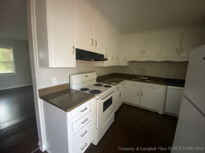 2711 Heatter Avenue Spring Lake, NC 28390 - Photo 5 of 14 a kitchen that has a sink and a stove