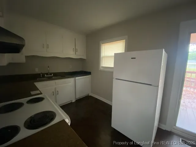 a refrigerator freezer sitting inside of a kitchen