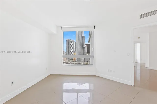 a bathroom with a toilet sink and shower
