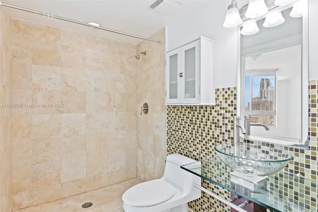 a bathroom with a bathtub and shower