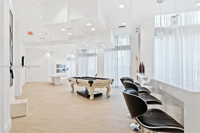 a projector room with furniture and a rug