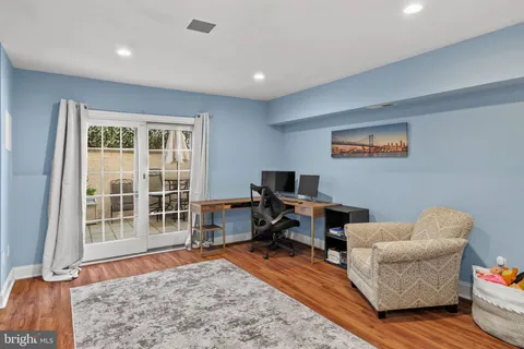 a workspace with furniture and a flat screen tv