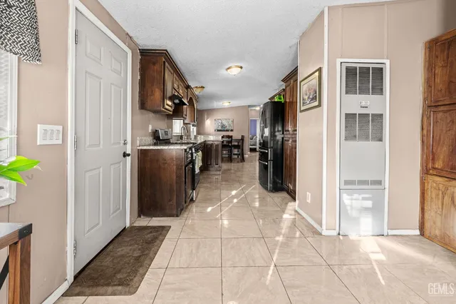 a view of a kitchen with an empty space and a kitchen