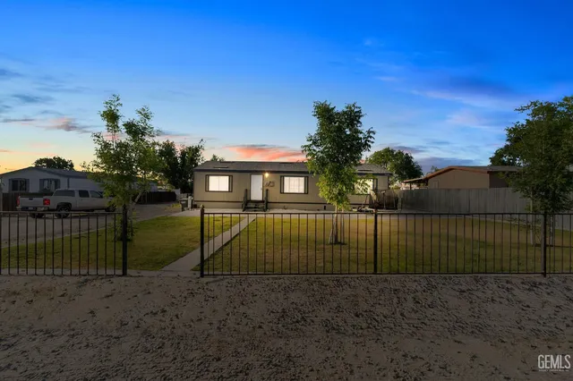 a view of backyard with green space