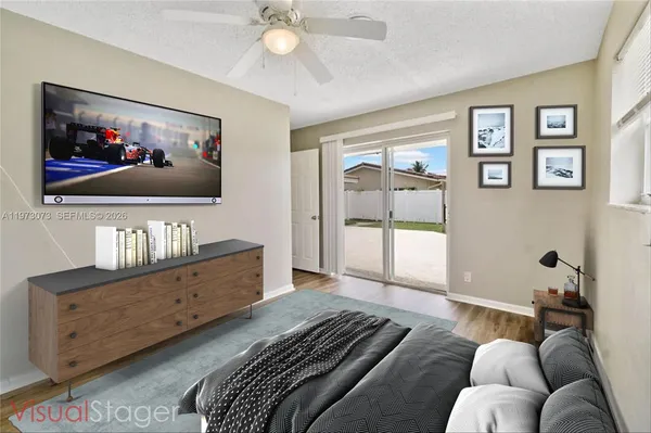 an empty room with wooden floor and door