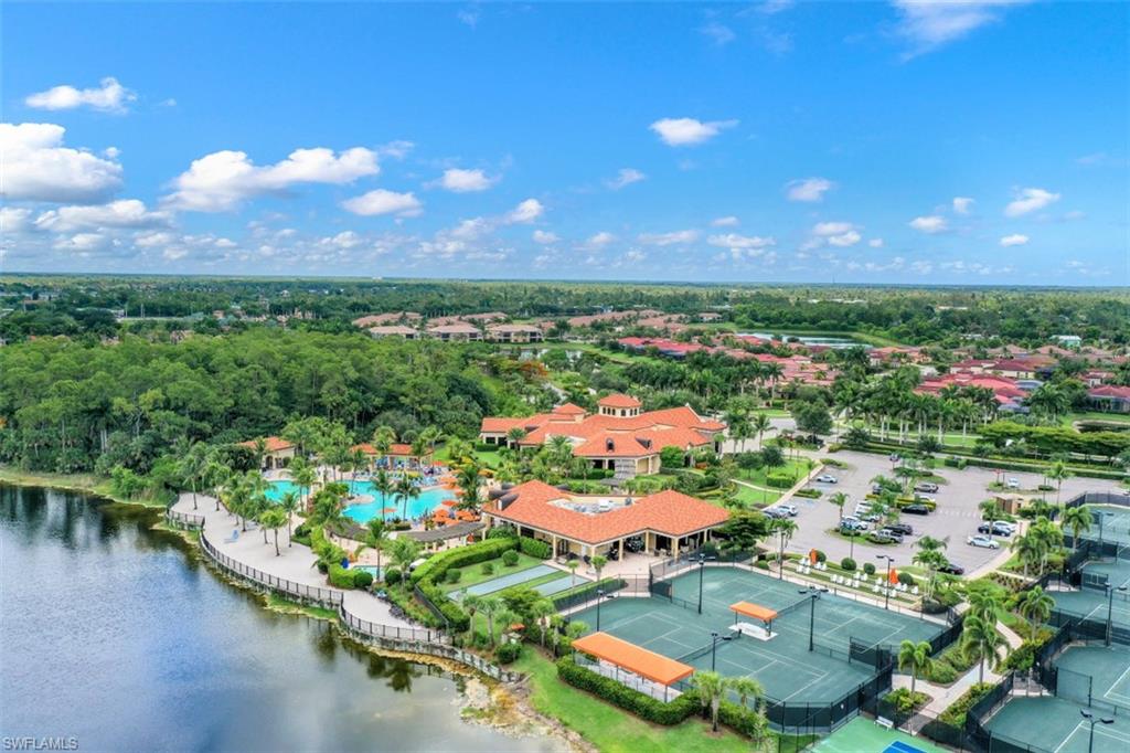 9530 Piacere Way Naples, FL 34113 - Photo 40 of 45 a view of a lake with a city
